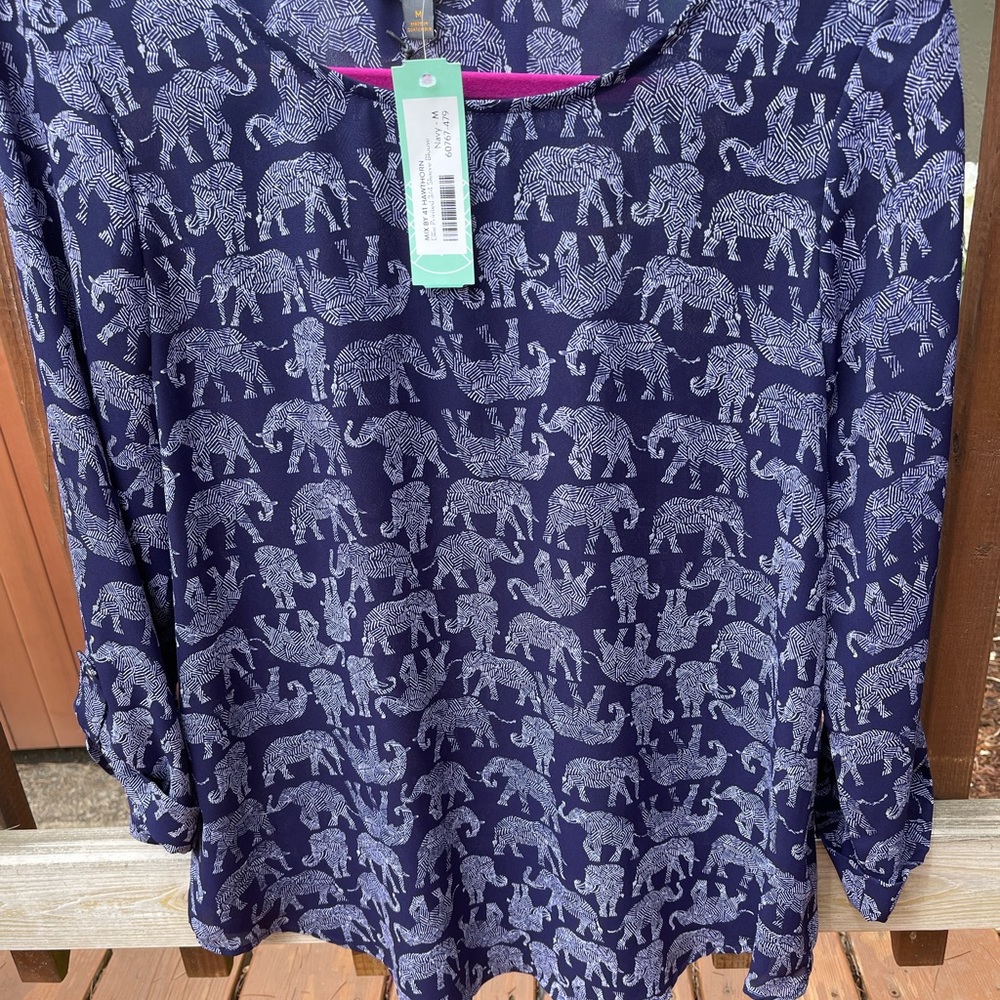 Navy blue blouse with elephant print.